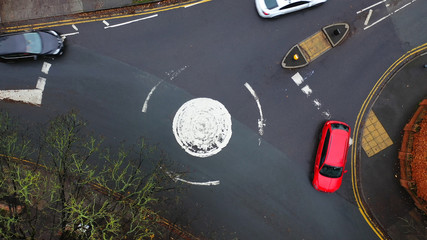 Aerial view of a roundabout road junction in the UK - obrazy, fototapety, plakaty