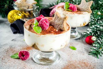 Christmas dessert idea, Gingerbread Tiramisu Trifle Parfaits woth fresh raspberry and mint leaves. copy space