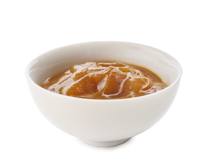 Tasty sauce in bowl on white background