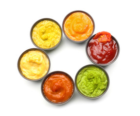 Obraz na płótnie Canvas Different tasty sauces in bowls on white background