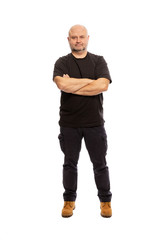Adult bald man is standing, portrait on white background