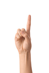 Female hand with raised index finger on white background