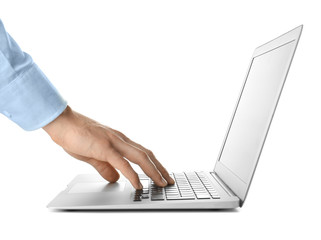 Young businessman using laptop on white background