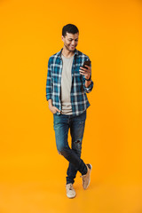 Fototapeta premium Full length portrait of a happy young man