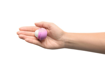 Woman holding hygienic lipstick on white background