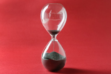 Hourglass on color background. Time management concept