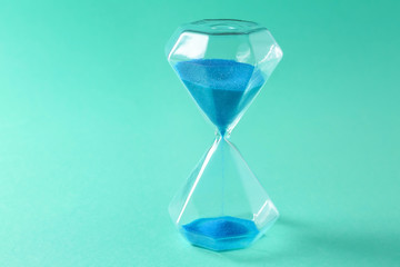 Hourglass on color background. Time management concept