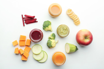 Flat lay composition with healthy baby food and ingredients on white background