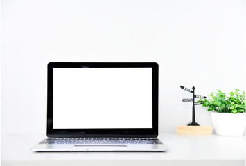 Working with Laptop computer,Hot coffee and plant copy space on desk background,business Concept