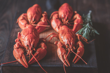 Boiled crayfish on the wooden board