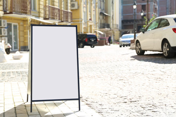 Blank advertising board on city street