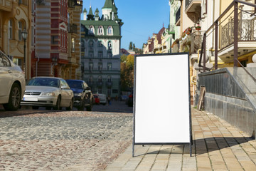 Blank advertising board on city street