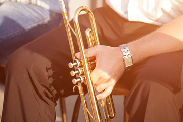 young man playing trumpet on street © Stanislaw Mikulski