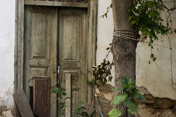 Fototapeta na wymiar slum poor wooden door in backstreet yard of ghetto dirty urban city district 