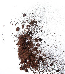 Coffee powder and coffee beans splash or explosion flying in the air
