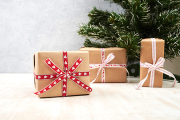 gift box with red ribbon and bow on wooden background