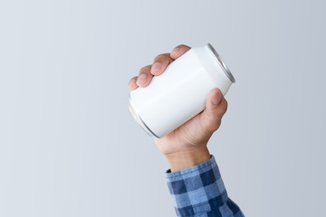 Man holding aluminum white can with clipping path