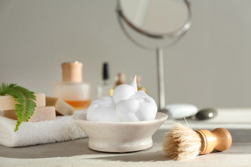 Shaving accessories on table in bathroom