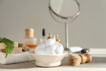Shaving accessories on table in bathroom