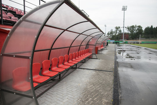Football bench or seat at sports stadium. Horizontal photo. Selective focusing.