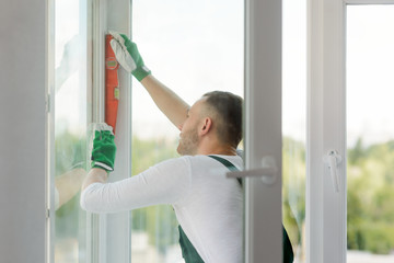 Foreman checking accuracy with level