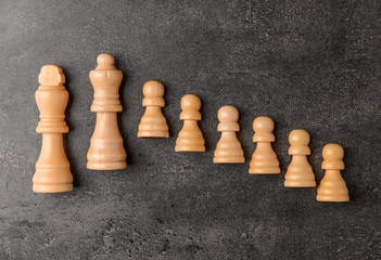 Chess pieces on grey background