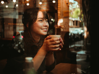 Asian woman drinking coffee in  coffee shop cafe - 237165394
