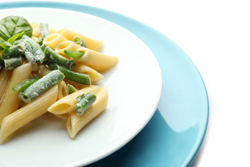 Plates with tasty penne pasta on white background, closeup