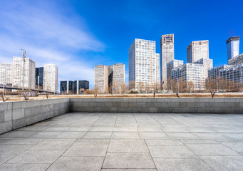 city skyline with empty square in urban