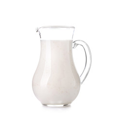 Jug of milk on white background