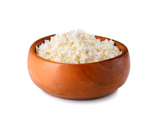 Bowl with cottage cheese on white background