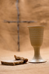 Chalice of wine with bread and cross