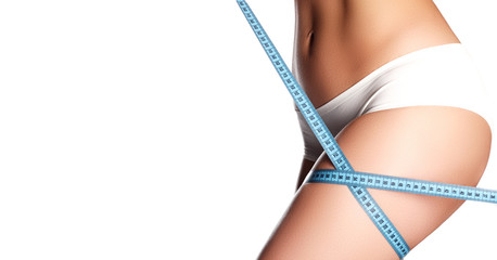 Perfect slim toned young body of the girl . An example of sports , fitness or plastic surgery and...