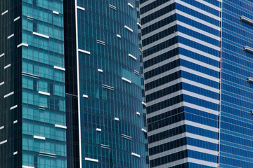 Detail of Windows of Two Mirrored Buildings in Blue