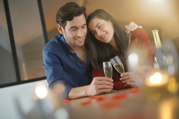  Romantic couple toasting with champagne for Valentine's Day