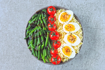 Colorful, healthy foods. flatlay. Buddha bowl with eggs, green beans and cherry tomatoes