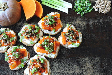 Healthy toasts with pumpkin and green onions. Pumpkin bruschetta