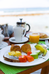 Breakfast consisting of Fresh Fruit and Pancakes