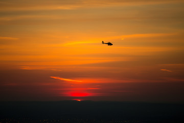 Beautiful image of a helicopter against the sun