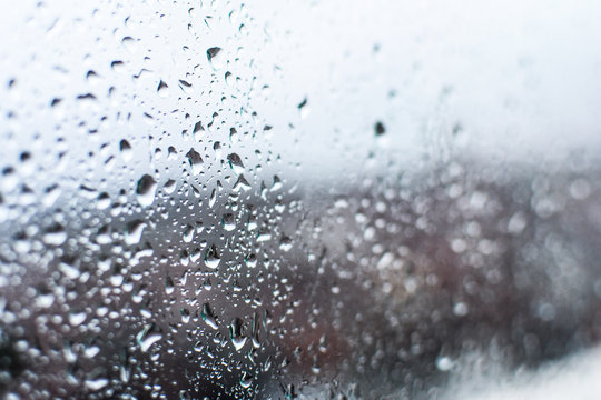 Water Drops, Rain Drops On Glass And Dripping Down