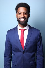 Beautiful black man in front of a colored background