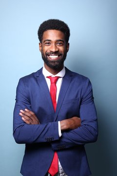 Beautiful black man in front of a colored background
