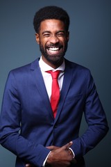 Beautiful black man in front of a colored background