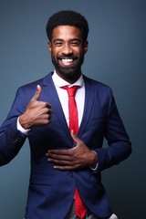 Beautiful black man in front of a colored background