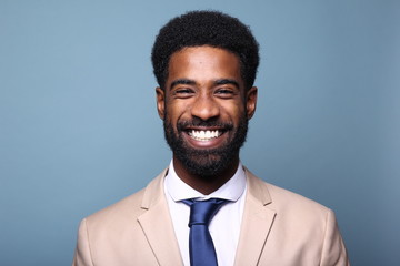 Beautiful black man in front of a colored background