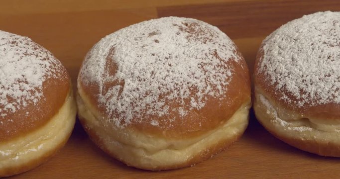 Jam-filled and sugar-dusted donuts zoom in