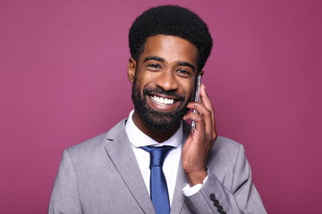 Beautiful black man in front of a colored background