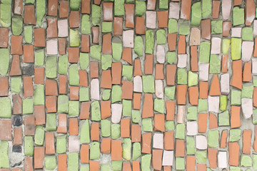Fototapeta premium Background from a multi-colored mosaic on a wall.