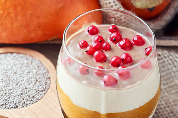 White chia seeds pudding made with Japanese persimmon, pumpkin, bananas and currants