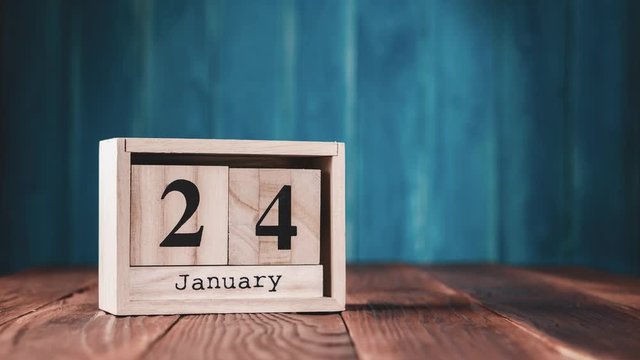 Retro wooden calendar for the year with fast flipping cubes, 366 days, leap year, stop motion.